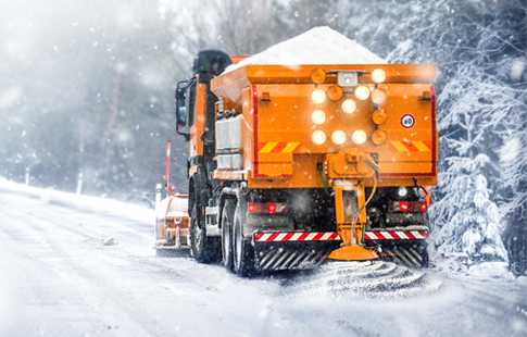 Gritter spreading salt on a icy road